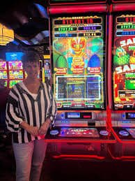 Filipino player enjoying online slot games on smartphone via bonus365